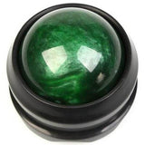 Boule de massage verte à base noire, idéale pour atténuer les douleurs musculaires et favoriser la relaxation